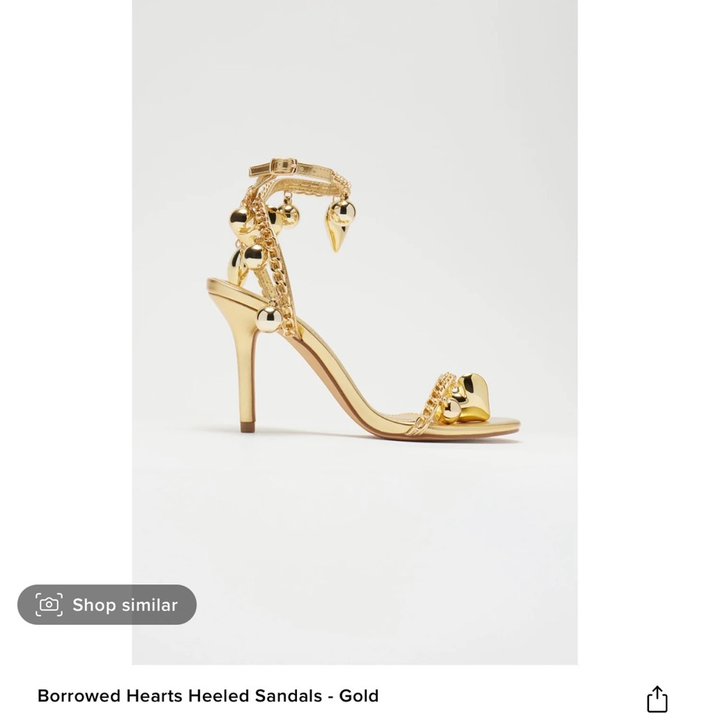 Gold heart studded heel